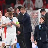 England manager Gareth Southgate walks past the European Championship trophy after losing the final on penalties to Italy (Photo by PAUL ELLIS/POOL/AFP via Getty Images)