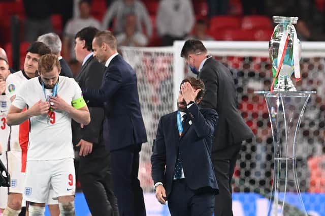 England manager Gareth Southgate walks past the European Championship trophy after losing the final on penalties to Italy (Photo by PAUL ELLIS/POOL/AFP via Getty Images)