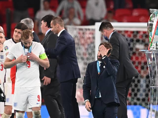 England manager Gareth Southgate walks past the European Championship trophy after losing the final on penalties to Italy (Photo by PAUL ELLIS/POOL/AFP via Getty Images)