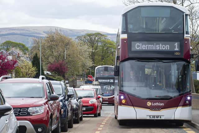 A new report from the Climate Emergency Response Group recommends using 'fiscal levers' such as pay-as-you-drive charges and road tolls to get people out of their cars and to improve public transport provision. Picture: Lisa Ferguson