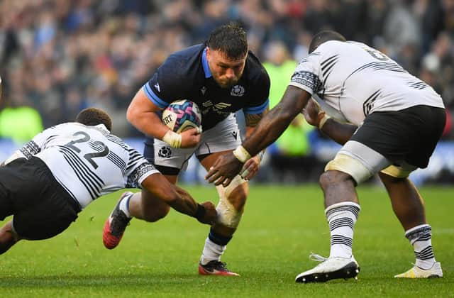 Scotland's Rory Sutherland breaks through against Fiji. (Photo by Ross MacDonald / SNS Group)