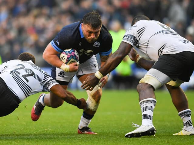 Scotland's Rory Sutherland breaks through against Fiji.   (Photo by Ross MacDonald / SNS Group)