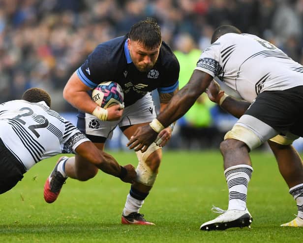Scotland's Rory Sutherland breaks through against Fiji.   (Photo by Ross MacDonald / SNS Group)
