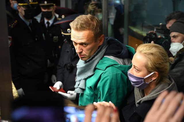 Russian police detained Kremlin critic Alexei Navalny at a Moscow airport shortly after he landed on a flight from Berlin