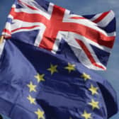 An EU flag and a Union flag fly near the House of Commons (Picture: Daniel Leal/AFP via Getty Images)