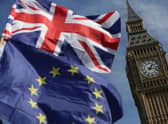 An EU flag and a Union flag fly near the House of Commons (Picture: Daniel Leal/AFP via Getty Images)