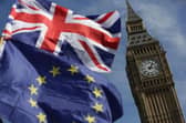 An EU flag and a Union flag fly near the House of Commons (Picture: Daniel Leal/AFP via Getty Images)