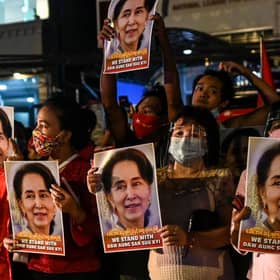 NLD supporters celebrate in front of the party's headquarters in Yangon following a landslide victory in the November 2020 election (Photo: YE AUNG THU/AFP via Getty Images)