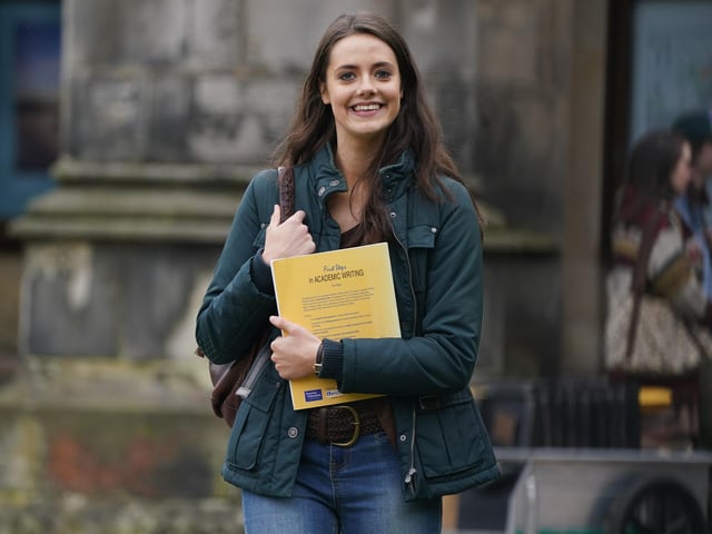 Actress Meg Bellamy was carrying a book entitled First Steps In Academic Writing.