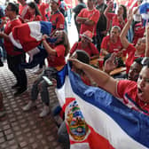 Costa Rican football fans react after watching their team qualify for the World Cup.