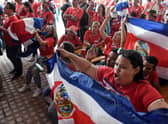 Costa Rican football fans react after watching their team qualify for the World Cup.