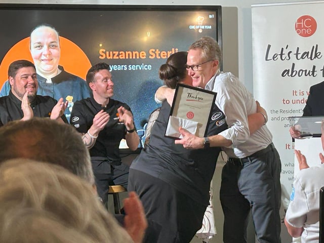 Suzanne Stirling, Group Development Chef at HC-One being presented with her 20 year long service award by James Tugendhat, Chief Executive Officer at HC-One at the HC-One Chef of the Year Competition 2025