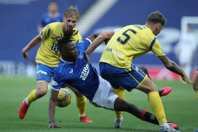 Jo Aribo of Rangers with Jason Kerr of St Johnstone during the Scottish Premier League match between Rangers and St Johnstone at Ibrox Stadium on August 12, 2020 in Glasgow, Scotland. (Photo by Ian MacNicol/Getty Images)