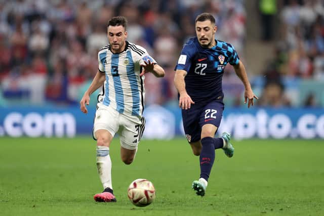 Celtic's Josip Juranovic in action for Croatia, being chased by Nicolas Tagliafico of Argentina, during the World Cup semi-final. (Photo by Clive Brunskill/Getty Images)