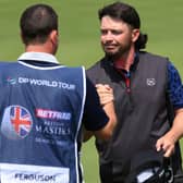 Ewen Ferguson of Scotland shakes hands with his caddie Stephen Neilson on the ninth green during day one of the Betfred British Masters hosted by Sir Nick Faldo 2023 at The Belfry. Picture: Andrew Redington/Getty Images.