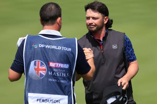 Ewen Ferguson of Scotland shakes hands with his caddie Stephen Neilson on the ninth green during day one of the Betfred British Masters hosted by Sir Nick Faldo 2023 at The Belfry. Picture: Andrew Redington/Getty Images.