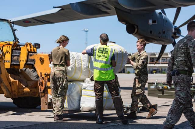 DFID - UK Department for International Development
UK aid shelter kits being unloaded from a Royal Air Force A400M flight at Beira airport, Mozambique, for people affected by Cyclone Idai, 26 March 2019
UK aid shelter kits being unloaded from a Royal Air Force A400M flight at Beira airport, Mozambique, for people affected by Cyclone Idai, 26 March 2019.
Picture: IOM