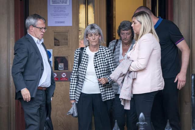 Jane Midgley (second left), mother of victim Simon Midgley, outside Paisley Sheriff Court where the fatal accident inquiry (FAI) into the deaths of two men, Simon Midgley, 32, and his partner Richard Dyson, 38, from London, in the Cameron House fire is being held. Issue date: Monday August 15, 2022. PA Photo. The inquiry, will look at issues around guest and fire safety at the hotel on the banks of Loch Lomond following the fatal fire in December 2017. See PA story INQUIRY Hotel Photo credit should read: Jane Barlow/PA Wire