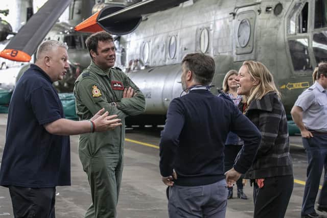 Mick McConnell (left), an ex RAF Police dog handler, during a visit to RAF Odiham in Hampshire to reunite him with the Chinook Crew that medically evacuated him