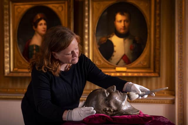 English Heritage of Keeper of the Wellington Collection Josephine Oxley preparing the death mask of Napoleon Bonaparte for display at Apsley House, London. Picture: Christopher Ison/English Heritage/PA Wire