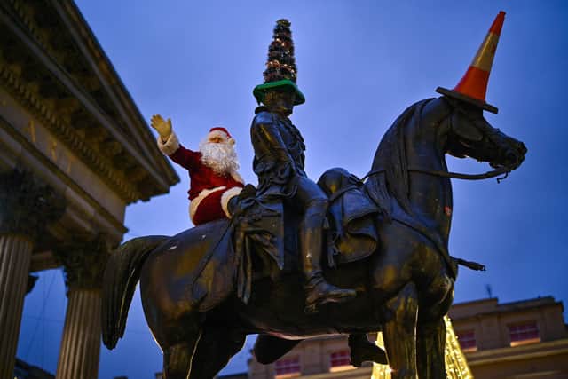 With Santa Claus joining the traffic cones on the Duke of Wellington's statue in Glasgow, some might say Scotland's 'Daft Days' have already returned (Picture: Jeff J Mitchell/Getty Images)