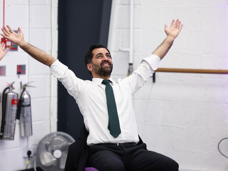Humza Yousaf takes part in a dance performance during a visit to the Edinburgh Community Performing Arts re-connect project