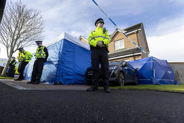 Police officers outside the home of former SNP chief executive Peter Murrell, and his wife Nicola Sturgeon, in Uddingston, after he was 'released without charge pending further investigation'. Picture: Robert Perry/PA