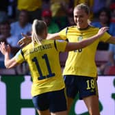 Sweden's striker Fridolina Rolfo (R) celebrates with Stina Blackstenius. (Photo by FRANCK FIFE/AFP via Getty Images)