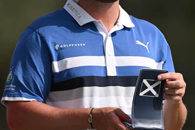Ewen Ferguson consults his yardage book during day twoo of the Commercial Bank Qatar Masters at Doha Golf Club. Picture: Stuart Franklin/Getty Images.