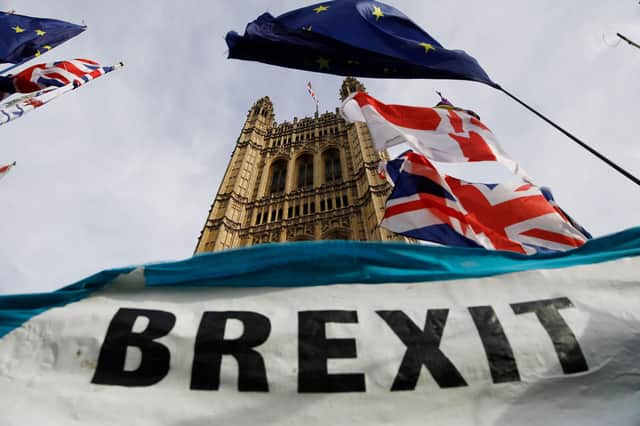 A pro-Brexit banner is seen outside the Houses of Parliament in London. Picture: Tolga Akmen/AFP via Getty Images