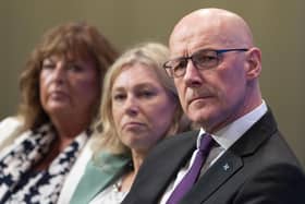 First Minister John Swinney listens as Deputy First Minister Kate Forbes delivers her address at the SNP Annual National Conference at the Edinburgh International Conference Centre. Picture: Jane Barlow/PA Wire