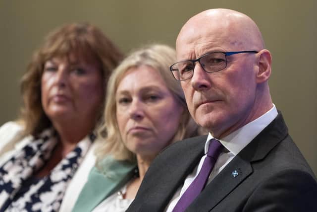 First Minister John Swinney listens as Deputy First Minister Kate Forbes delivers her address at the SNP Annual National Conference at the Edinburgh International Conference Centre. Picture: Jane Barlow/PA Wire