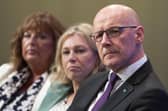 First Minister John Swinney listens as Deputy First Minister Kate Forbes delivers her address at the SNP Annual National Conference at the Edinburgh International Conference Centre. Picture: Jane Barlow/PA Wire