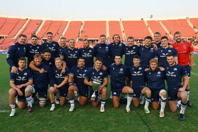 Scotland players pose with the trophy after the 52-11 victory over Chile. (Photo by Marcelo Hernandez/Getty Images for Scottish Rugby)