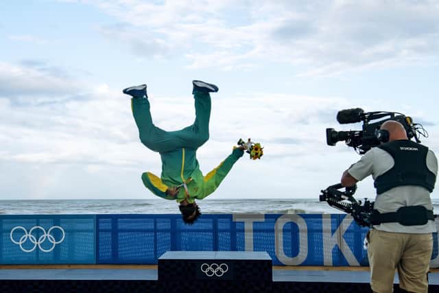 Brazil's Italo Ferreira celebrates after winning gold in the men's surfing competition at the 2020 Olympics PIC: Olivier Morin/Pool Photo via AP