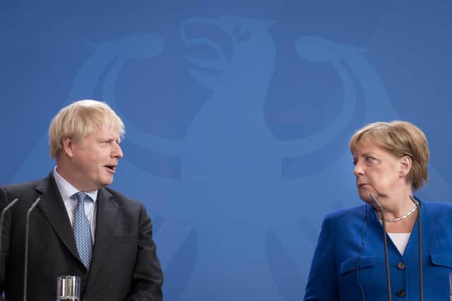 Boris Johnson managed to persuade European leaders like Germany's Angela Merkel to agree to a Brexit trade deal that will benefit Scotland, says Murdo Fraser (Picture: Stefan Rousseau/PA)