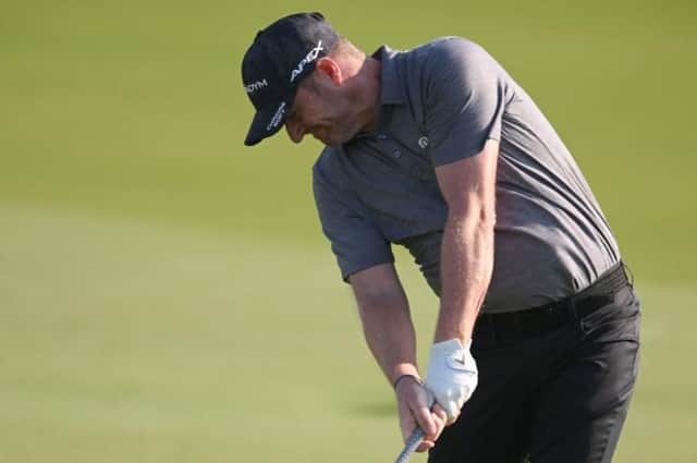 Marc Warren plays his second shot on the 11th hole in the second round of the Abu Dhabi HSBC Championship at Yas Links. Picture: Ross Kinnaird/Getty Images.