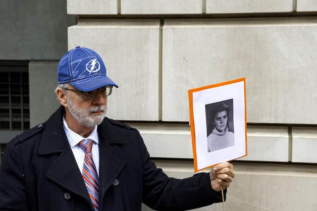 Paul Hudson holds a picture of his daughter Melina, a victim of the Lockerbie bombing, outside a court in Washington DC where alleged bombmaker Abu Mas’ud made a brief appearance this month (Picture: Anna Moneymaker/Getty Images)