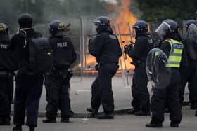 Derbyshire police said they are ‘monitoring the information about any events planned’ while a ‘full operational and resourcing plan’ is in place. Pictured are riot police officers outside the Holiday Inn Express Hotel which is housing asylum seekers in Rotherham.