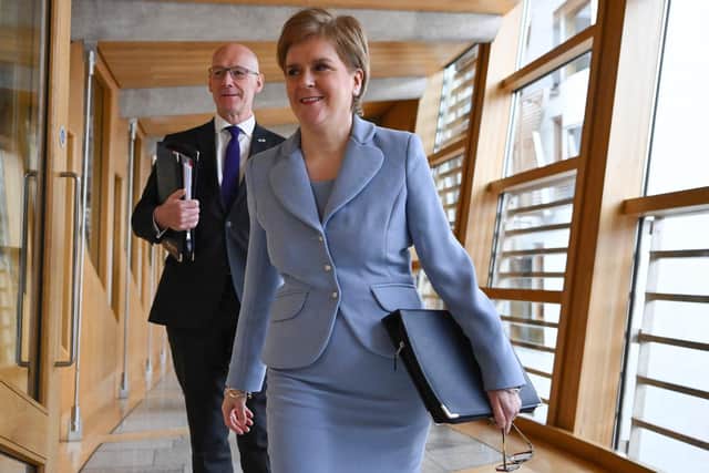 Nicola Sturgeon, seen with John Swinney in Holyrood, has announced the date of a proposed second referendum on Scottish independence (Picture: Jeff J Mitchell/Getty Images)