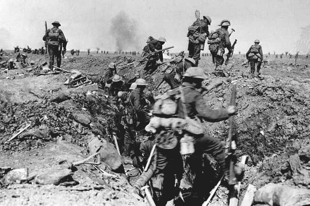 British troops negotiate a trench as they go forward in support of an attack on the village of Morval during the Battle of the Somme on September 25, 1916 (Picture: PA)