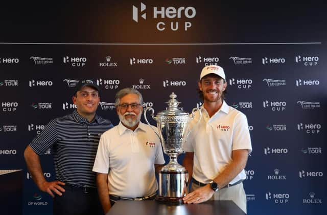 Francesco Molinari, captain of Continental Europe, and Tommy Fleetwood, captain of Great Britain and Ireland, pose with the Hero Cup along with Dr Pawan Munjal, chairman and CEO of Hero MotoCorp, at Abu Dhabi Golf Club. Picture: Andrew Redington/Getty Images.