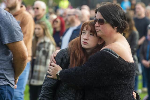 Onlookers at Holyrood Park watch the funeral of Queen Elizabeth II. Picture: Lisa Ferguson