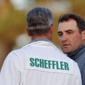 Scottie Scheffler talks with caddie Ted Scott on the 18th green during the third round of the Masters at Augusta National Golf Club. Picture: Jamie Squire/Getty Images.