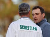 Scottie Scheffler talks with caddie Ted Scott on the 18th green during the third round of the Masters at Augusta National Golf Club. Picture: Jamie Squire/Getty Images.