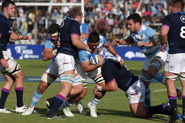 Pablo Matera of Argentina is tackled by Jonny Gray and Zander Fagerson. (Photo by Daniel Jayo/Getty Images)