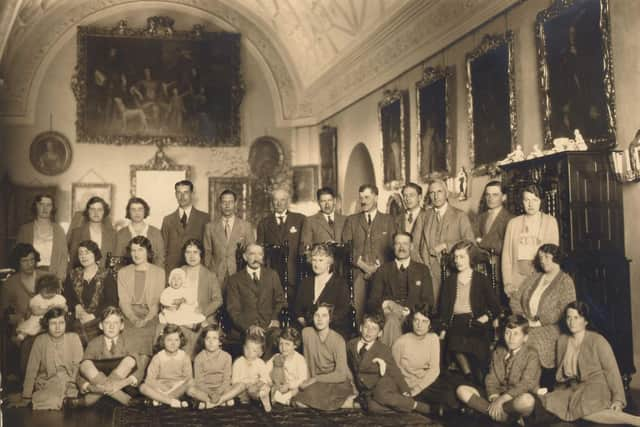 The photograph chosen by HM The Queen for the anniversary book, A Glamis Treasury. Her Majesty is in the front row holding a teddy bear.