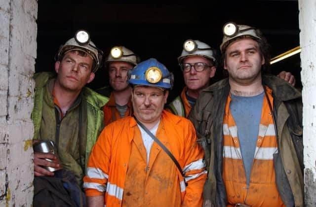 The last miners reach the surface following the final shift at Longannet colliery, which closed in 2002. The Fife pit was the last remaining deep mine in Scotland. From left, Stewart Steele, Kevin Skelton, Lachie Farries, Kenneth Nicholson and Stewart Nicholson. Picture: Robert Perry