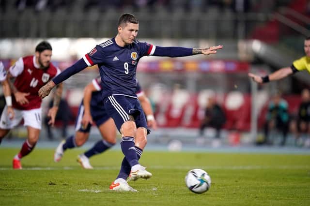 Lyndon Dykes scores from the spot to put Scotland 1-0 up. Picture: SNS