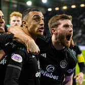 Celtic's Adam Idah celebrates with Anthony Ralston after netting late to beat Hibs.